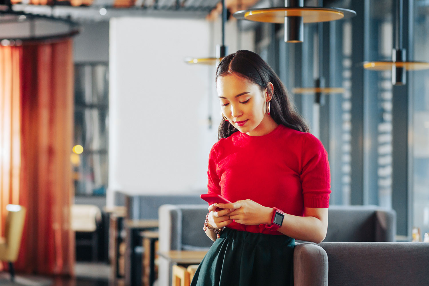 women texting on cellphone