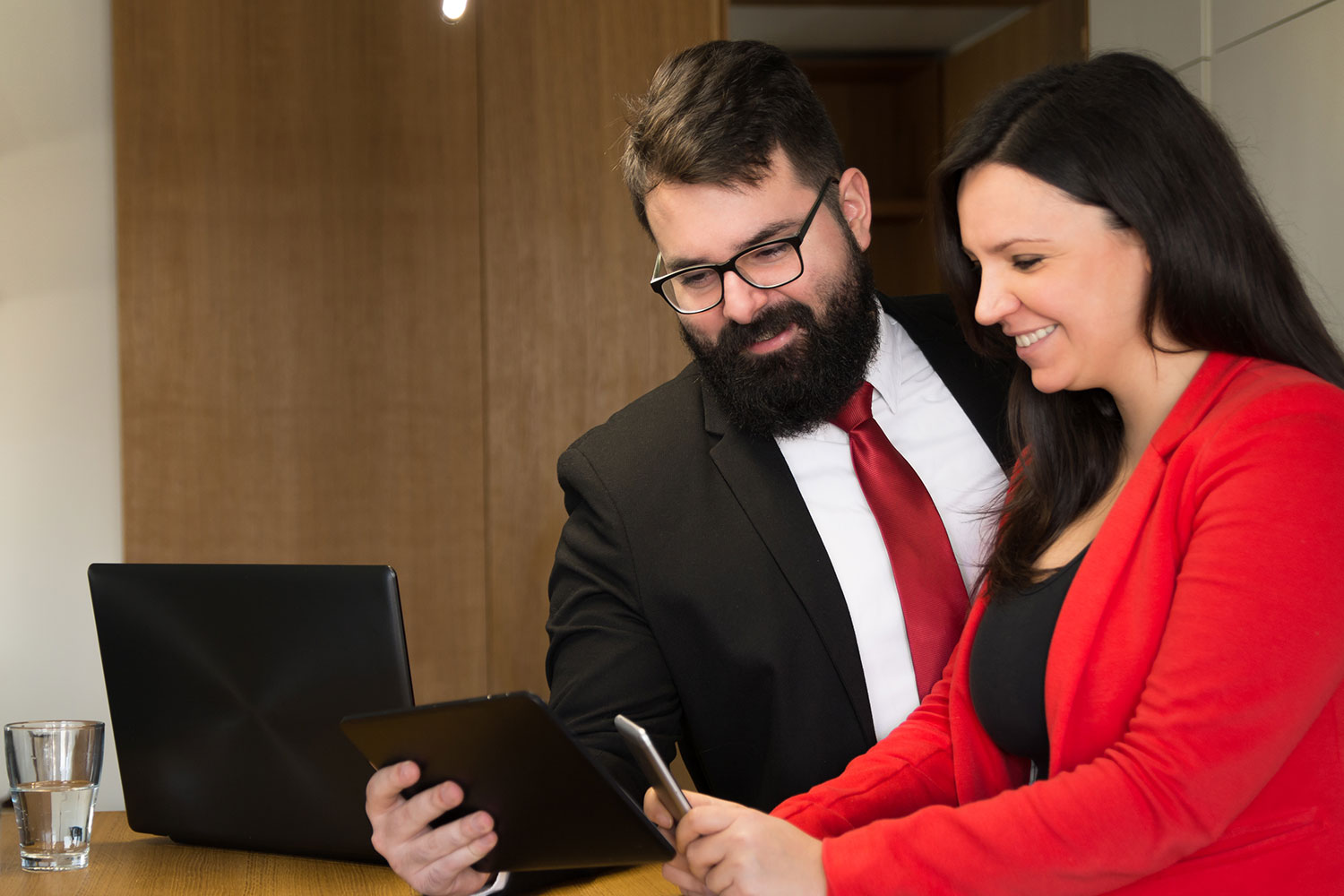 Man and woman using their mobile devices.