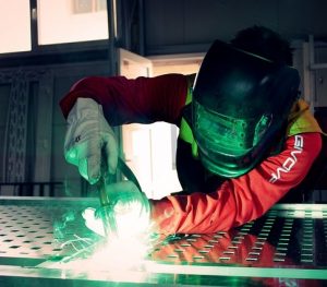 Women using a welder