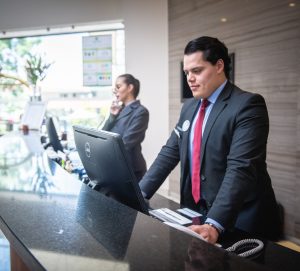 hotel clerk on computer