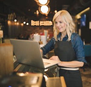 Women at bar on computer