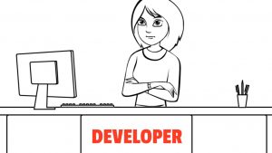 Developer sitting at their desk with arms crossed.