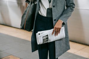 person holding newspaper