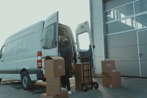 delivery driver unpacking fragile boxes